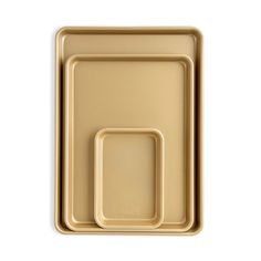 a gold tray with two square plates on the top and one rectangular plate on the bottom