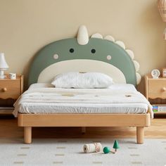 a child's bed with an animal head on it