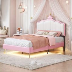 a pink and white bedroom with princess bed, nightstands and mirror on the wall