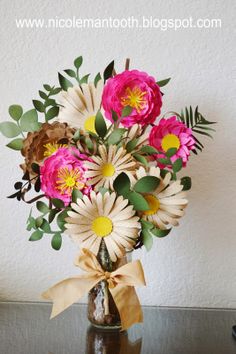 a vase filled with flowers on top of a table