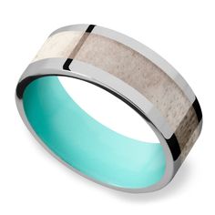 men's wedding band with an aqua blue ceramic center and black inlays