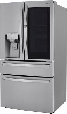 a silver refrigerator freezer sitting next to a wall mounted appliance with the door open