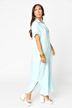 Look comfy and cute at the beach in this Carmen Cover Up Maxi Dress! Crafted in lightweight gauze, it features short sleeve and buttons running all down the front. Product Details: Fit: The Carmen Dress fits true to size. Length: Maxi length. The small measures to be 53.5" from shoulder to hem. Bust: Relaxed fit accommodates most bust sizes. Waist: Relaxed fit. Fabric: Fabric contains no stretch. Material: 100% Cotton Summer Button-up Maxi Dress For Beach, Summer Cotton Maxi Shirt Dress, Summer Beach Shirt Dress With Rolled Sleeves, Cotton Maxi Shirt Dress For Beach, Summer Vacation Button-up Maxi Dress, Summer Button-up Maxi Dress, Cotton Maxi Shirt Dress For The Beach, Flowy Short Sleeve Shirt Dress For Summer, Spring Beachwear Maxi Dress With Short Sleeves