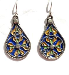 this is a beautiful pair of vintage style silver Berber enamelled earring from Morocco.  It is all handmade by the best Berber silver smith in Morocco.  The silver is over 90% Size: 2 inch long and 22mm wide Moroccan Jewelry, Dream Catcher Earrings, Hammered Hoop Earrings, Antique Bracelets, Sterling Silver Hoop Earrings, Enamel Earrings, Antique Earrings, Pretty Earrings, Sterling Silver Hoops