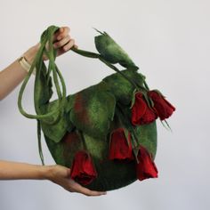 The bag is a great gift for women. Bag  is made of merino wool. Inside, inner pocket, lined.  This bag is completely handmade by wet felting technique. It is seamless, durable and of high quality.    Handbag with decorative leaves and red rose flowers. They cutely decorate the bag. The flowers can be removed, the handles can be lengthened or shortened.     Size: 12*12 inches without handles! Handle length 36.6 inches To make your look perfect, you can also order accessories (brooch, belt, bracelet, scarf). CARE: wool is handy to use and very easy.Hand wash and rinse in  soapy water 35-40. degrees' . Squeeze without twisting, squeezing into a ball, give shape and dry. The first flock (pilling peeling) are removed by hand. Please feel free to contact me if you have any other questions! To se Felted Bag, Felted Handbags, Decorative Leaves, Great Gifts For Women, Flowers Gift, Felt Bag, Wet Felting, Rose Flowers, Soapy Water