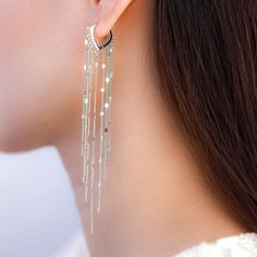 Sparkling tassel chain hoop earrings – The Silver Luna Trendy Silver Dangle Tassel Earrings, Silver Metal Chandelier Earrings With Tassels, Trendy Metal Dangle Threader Earrings, Trendy Silver Threader Earrings For Party, Elegant Tassel Hoop Earrings, Dangle Threader Earrings With Adjustable Chain For Party, Metal Dangle Threader Earrings For Party, Metal Long Drop Tassel Earrings, Long Drop Metal Tassel Earrings