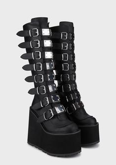 Demonia Swing-815 Buckle Knee High Platform Boots - Black – Dolls Kill Edgy Streetwear Platform Boots With Buckle Closure, Edgy Platform Boots With Buckle Closure For Streetwear, Gothic Platform Boots With Buckle Closure For Streetwear, Edgy Platform Boots With Buckle For Alternative Fashion, Demonia Trinity Boots, Trinity Boots, Goth Platform Shoes, Shoes Platform Boots, Goth Platforms