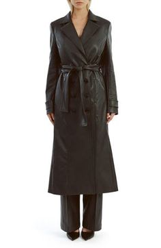 Update your outerwear portfolio with this sleek faux-leather trench coat featuring a classic notched collar and a matching tie belt. 48" length (size Small) Front button closure Notched collar Front welt pockets Removable tie belt Back vent Lined 55% polyester, 45% cotton with polyurethane coating Hand wash, line dry Imported Elegant Belted Leather Jacket For Winter, Elegant Winter Leather Jacket With Belt, Fitted Leather Jacket With Belted Cuffs, Sleek Formal Outerwear With Belted Cuffs, Belted Long Faux Leather Coat, Belted Faux Leather Long Coat, Belted Long Leather Jacket For Business, Formal Leather Outerwear With Belted Cuffs, Belted Leather Long Coat For Business