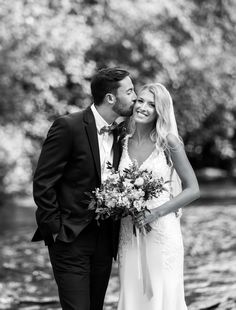 a bride and groom standing next to each other