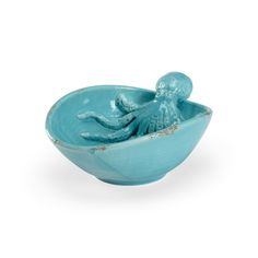 a blue bowl with an octopus in it