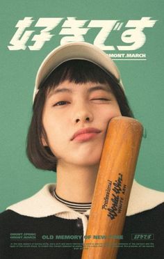 a woman holding a baseball bat in front of her face