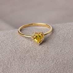 Yellow Topaz; It is known as the stone of abundance and fertility and has energizing properties. It purifies the mind from excesses and helps the person to have a comfortable sleep at the end of the day. Yellow Topaz is one of the strong and powerful healing stones. Our 14K Solid Gold heart-cut yellow topaz ring surrounded by real diamonds is suitable for daily use with its special design and will be your indispensable jewelry that you can use on your special days. A stylish jewel for you and yo Citrine Birthstone Diamond Ring Gift, Gift Citrine Birthstone Diamond Ring, Yellow Crystal Birthstone Ring For Promise, Yellow Birthstone Crystal Ring For Promise, Yellow Crystal Birthstone Ring Gift, Yellow Birthstone Ring For Promise, Gold Gemstone Heart Ring For Promise, Heart-shaped Yellow Gold Birthstone Ring, Heart Cut Topaz Ring Birthstone As A Gift