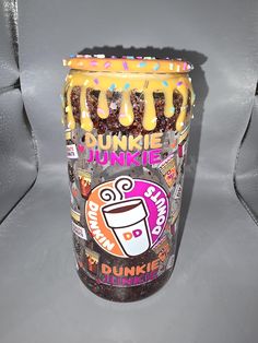 a dunkin donuts cup sitting on top of a table