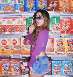 a woman standing in front of cereal display