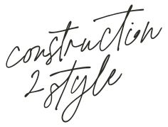 the words construction and style written in black ink