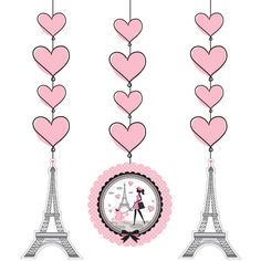 the eiffel tower has hearts hanging from it's sides and is decorated in pink