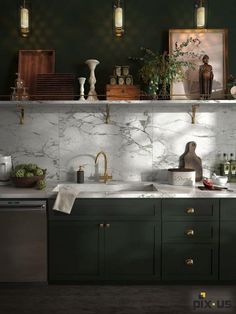 a kitchen with green cabinets and marble counter tops, gold faucets and brass pulls