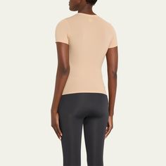 SKIMS body-hugging t-shirt Crew neckline Short sleeves Formfitting Pullover style Nylon/polyamide/spandex Imported Bergdorf Goodman, Top Designers, Pullover Styling, Crew Neckline, Tops Designs, Short Sleeves, Spandex, Crew Neck, Luxury Fashion