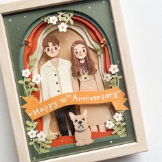 an anniversary card with two people and a dog