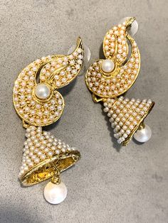 Traditional Bollywood Statement Earrings, Glamorous Indian Pearl Wedding Bell Dangles These beautiful Hollywood Regency /Bollywood Style are both Ornate and at 7mm long - make an elegant statement too! They are perfect for the holiday season- romantic and festive - and would Look lovely ringing in the New Year on New Years Eve! And Pearl is super trending, too!! If you are getting married they compliment a number of styles from Boho Glam to tribal & yoga inspired themes to more traditional v Traditional White Pearl Earrings For Reception, Festive White Pearl Earrings With Intricate Design, White Jhumkas With Latkans For Reception, Elegant Pearl Earrings With Latkans For Reception, Traditional Elegant Pearl Earrings For Weddings, Traditional Wedding Pearl Earrings With Elegant Design, Traditional Elegant Wedding Pearl Earrings, Pearl Drop Jhumkas For Reception And Festivals, White Bollywood Jhumkas For Reception