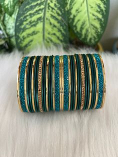 The perfect accessory for your special occasions, these green  and golden Color Bangles feature Pearl and Stone detailing. Crafted with copper, these bangles are sure to add a touch of elegance and glamour to your look. Features: * Copper material *  Stone detailing *  green  and golden Color * Size: 2.6,2.10 Adjustable Green Bangle For Party, Green Bangle For Party Festivals, Green Bangle For Party And Festivals, Adjustable Green Bangle For Celebration, Traditional Green Bracelets For Party, Festive Green Bangle For Celebration, Adjustable Green Bracelet For Celebration, Adjustable Green Bracelets For Celebration, Festive Green Bracelets For Celebration