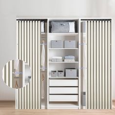 an open closet with white drawers and striped curtains