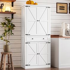 PRICES MAY VARY. 【RUSTIC FARMHOUSE DESIGN】With the clean white finish and barn door design, farmhouse pantry cabinet accented by black metal hardware, which combines perfectly farmhouse charm with your modern home. Whether your room is modern or vintage, this kitchen pantry cabinet adds different appeal to your space and shows your impeccable taste. 【SPACIOUS STORAGE CAPACITY】The tall pantry storage cabinet measures at 15.6" D x 30.3" W x 67.7" H. The kitchen pantry comprises 1 large drawer and Space Saving Pantry, Farmhouse Pantry Cabinet, Cabinet With Barn Doors, Farmhouse Pantry Cabinets, Storage Cabinet For Kitchen, Farmhouse Kitchen Pantry, White Farmhouse Kitchen, Cabinet For Kitchen, White Pantry