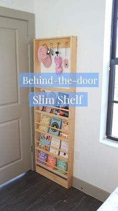 a book shelf in the corner of a room with an open door and text behind it that reads, behind the door slim shelf