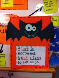 a bulletin board with bats and words on it