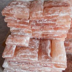 several pieces of pink and white ice cubes stacked on top of each other