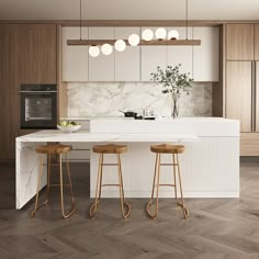 a modern kitchen with marble counter tops and wooden stools