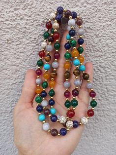 material: Color natural stone Made of natural stones, this necklace consists of all kinds of natural stones. It will give you positive energy and healing. It will look great on your neck. Please feel free to send me a message about the product and I will reply you immediately. https://www.etsy.com/shop/Hirajewelrydesign?ref=seller-platform-mcnav Multicolor Natural Stones Gemstones For Healing, Spiritual Long Crystal Necklace With Colorful Beads, Multicolor Natural Stones For Healing, Healing Multicolor Natural Gemstones, Round Beaded Mineral Crystal Necklaces For Gifts, Gemstone Round Beads Necklaces For Meditation, Mineral Crystal Beaded Necklace With Round Beads As Gift, Multicolor Necklaces With 108 Beads For Healing, Multicolor Gemstone Crystal Necklaces