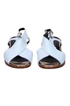 Step into summer with these stylish Robert Clergerie white leather sandals accented with reflective rose gold heels and trim. A versatile staple for any wardrobe, pair it with linen crop pants and a knit top for a chic summer look. Size 8 (FR 38.5) Made in France Leather upper Buckle ankle closure Rose gold trim and heel Heel height 2" White Leather Sole Heels For Summer, Modern Slingback Sandals With Leather Sole For Summer, Luxury Summer Slingback Sandals With Open Heel, Luxury Open Heel Slingback Sandals For Summer, White Leather Slingback Sandals For Spring, Leather Slingback Sandals With Contrasting Heel For Summer, White Slingback Sandals With Removable Insole For Summer, Summer Slingback Sandals With Ankle Strap And Contrasting Heel, Summer Open Toe Slingback Sandals With Contrasting Heel