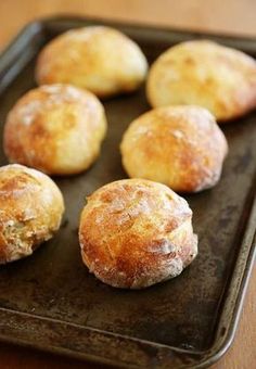 several pastries on a baking tray ready to be baked in the oven or used as an appetizer