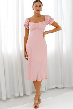 Blush midi dress  Partially lined  Off-shoulder style  Ruched bodice  Elasticated puff sleeves  Tie at back  Zipper in back   Stop what you are doing because this dress deserves a moment. Jaws will drop when you strut by in our adorable Linka midi dress. Featuring an off-shoulder style and the cutest puff sleeves, we're head over heels! Perfect for a wedding or special occasion paired with strappy heels and statement earrings. Hello, gorgeous! Blush Midi Dress, Hot Party Dresses, Selfie Leslie, Light Pink Dress, Off Shoulder Fashion, Blush Dresses, Hello Gorgeous, Pink Midi Dress, Head Over Heels