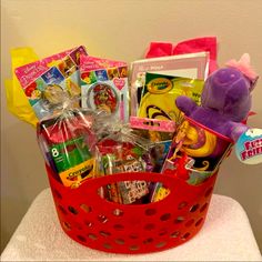 a red basket filled with lots of toys