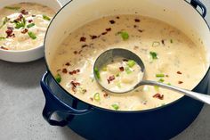 two bowls filled with soup on top of a table