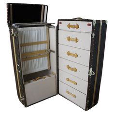 This impressive Louis Vuitton wardrobe features monogramm canvas, lozine trim, LV stamped solid brass locks and studs as well as solid brass corners. It has got a lift top that closes thanks to two Vuitton stamped brass locks. Its interior is remarkable with a folding hanging section and its original hangers on one side as well as a suitcase for shoes then on the other side, a series of seven drawers. Serial number label. It still has got its 2 original working keys. It would be perfect in a lob Wardrobe Trunk, Trunk Makeover, Trunks For Sale, Luggage Trunk, Antique Steamer Trunk, Sac Louis Vuitton, Brass Corners, Louis Vuitton Trunk, Old Trunks