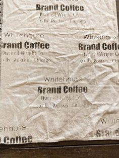 a white coffee bag sitting on top of a wooden table