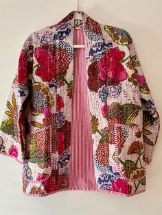 Perfect for adding a burst of color and flair to your wardrobe. This japanese style open jacket is made with embroidery patchwork kantha quilt fabric which is fresh and new. The hand stitching is the specialty of the piece you will see. The jacket is not reversible, but we love to showcase the pinstripes inside by adding a roll or two on the sleeves. You really get a feel for the playful mix of hues and patterns which bring a lively, artistic touch to any outfit, while the lightweight fabric ens Spring Outerwear With Patchwork And Kimono Sleeves, Pink Bohemian Cotton Outerwear, Multicolor Patchwork Outerwear With Kimono Sleeves, Multicolor Cotton Outerwear With Floral Print, Pink Long Sleeve Kimono With Patchwork, Pink Long Sleeve Cotton Kimono, Multicolor Cotton Outerwear With Kimono Sleeves, Long Sleeve Cotton Kimono With Patchwork, Cotton Patchwork Long Sleeve Kimono