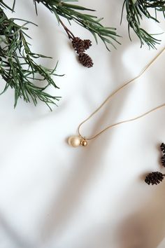 This stunning miniature Christmas baubles necklace is made of stainless steel and is 14k gold plated, lead and nickel free. It makes a fantastic Christmas gift for you or your loved ones. Chain length: 40cm + 5cm extender chain All of our jewellery comes beautifully packaged in our branded gift box. Your jewellery will last longer if you correctly care for your item. Care instructions: Always remember to remove your jewellery before shower or exercise. Please avoid contact with perfumes, body oils, and other chemicals, including household cleaners. For cleaning, gently polish with a soft, lint-free cloth to avoid scratching. Please store it in a cool dry place. If you have any questions do not hesitate to contact me, I will be more than happy to answer! Follow @donlonco on Instagram to see Elegant Gold Jewelry For Holidays, Elegant Gold Jewelry For Holiday, Elegant Holiday Gold Jewelry, Elegant Gold Necklace For Holidays, Festive Gold Jewelry With Delicate Chain, Gold Necklace For Christmas Celebration, Gold Pendant Jewelry For Christmas, Gold Necklaces For Holiday, Gold Jewelry For Festive Holiday Occasions