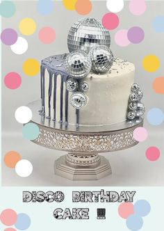 a birthday cake with disco balls on top and the words disco birthday cake below it