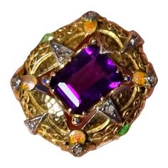 Art Nouveau Amethyst Ring with Enamel & Diamonds Art Nouveau jewelry is instantly recognizable by its embrace of natural forms and its focus on expert techniques, particularly exquisite enamel work. The Art Nouveau and related Arts and Crafts movements celebrated the beauty of all things handmade. Gold and silver were manipulated to a softness that seemed alive. Fabulous hammer gold work and delicate enamel mount ring. A rich, deep purple faceted amethyst; measurements: 9.17X8.06X6.80mm, emerald Art Deco Enamel Jewelry For Anniversary, Collectible Hallmarked Enamel Ring In Fine Jewelry Style, Art Deco Multi-stone Collectible Jewelry, Art Deco Enamel Ring Jewelry, Art Deco Enamel Jewelry Ring, Art Deco Enamel Ring As A Gift, Art Deco Enamel Ring As Gift, Vintage Gemstone Enamel Ring As A Gift, Vintage Enamel Gemstone Ring For Gift