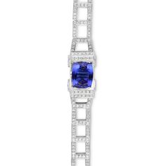 3.59 carat cushion cut Tanzanite 
1.90 carat white diamonds pave