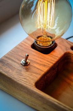 a light bulb sitting on top of a wooden box