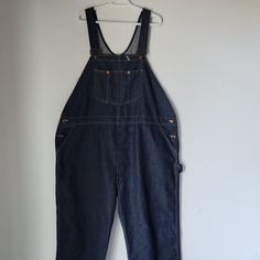 Vintage Montgomery Ward Blue Denim Work Overalls Bib Polyester Cotton Blend Made In Usa Condition Is Pre-Owned In Good Condition. Some Holes On Leg Area, See Pictures. Please Note: Don't Go By Size Number, Do Check Measurements Listed Below To Determine If The Item Will Fit. Actual Measurements: Approximately (Laying Flat). -Waist: 26 Inches -Hip: 28 Inches -Length: 47 Inches The Condition Guide: -New With Tags - Never Been Used Condition. Tags Are Still Attached. -New Without Tags - No Wear To Relaxed Fit Bib Front Denim Jeans, Utility Denim Bib Front Bottoms, Utility Denim Bottoms With Bib Front, Dark Wash Denim Overalls For Work, Denim Bib Front Jeans For Workwear, Bib Front Denim Blue Jeans, Medium Wash Bib Front Jeans For Work, Dark Wash Straight Leg Overalls For Work, Workwear Denim Overalls In Medium Wash