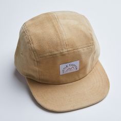 We love to wear our classic Corduroy Camping Hat all year around! This unstructured 5-panel hat features our Little Canyon logo on a woven label, fabric eyelets, 4 rows of stitching on a classic flat visor, with a cotton sweatband and an adjustable velcro back for easy and comfortable fastening. This beautiful hat is a perfect addition to any Little Canyon outfit. Adjustable. One Size available in Sand. Adjustable Cotton Baseball Cap With Flat Brim, Cotton 5-panel Snapback Hat For Spring, Adjustable Cotton Hats For Everyday, Spring Cotton 5-panel Snapback Hat, Adjustable Canvas Dad Hat For Everyday, Spring Cotton Hat With Logo Patch, Casual Canvas Hat With Flat Bill, Brown Cotton Baseball Cap With Short Brim, Adjustable Cotton Hat For Everyday