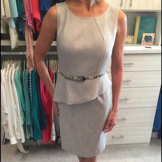 This Natural Peplum Dress Is Versatile And Professional. Chic Fitted Gray Dress, Chic Gray Fitted Dress, Chic Gray Dresses For Work, Fitted Gray Spring Dress, Fitted Gray Dress For Spring, Gray Knee-length Office Dresses, Chic Gray Dress For Office, Chic Gray Office Dress, Fitted Gray Knee-length Dress