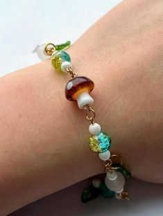 A earthy braclet to show off your fairy side. Green beads accompanied by a glass mushroom and natural stones. Mushroom Bracelet, Mushroom Beads, Glass Mushrooms, Green Beads, Green Bead, Natural Stones, Jewelry Bracelets, Stuffed Mushrooms, Beaded Bracelets