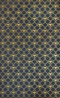 a black and gold wallpaper with an intricate design